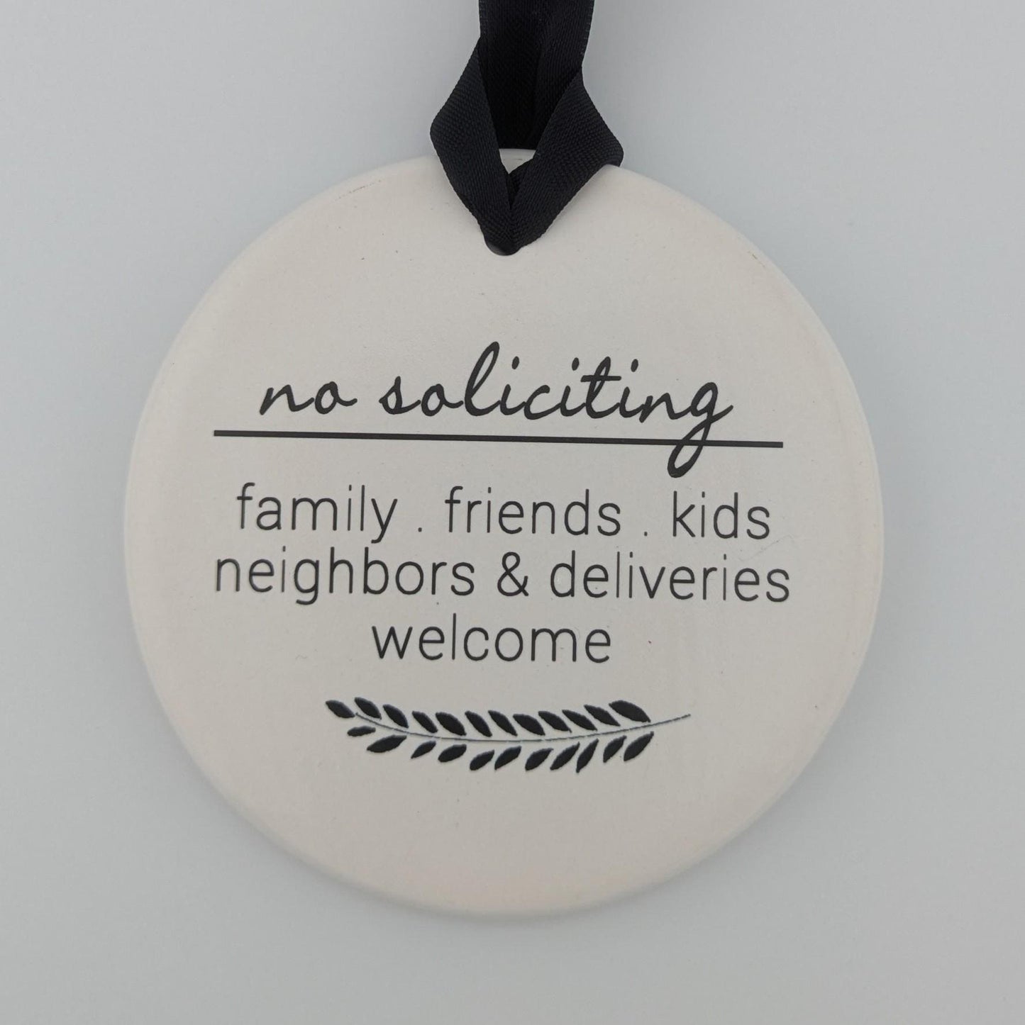 Sign: No Soliciting, Family and Friends Welcome